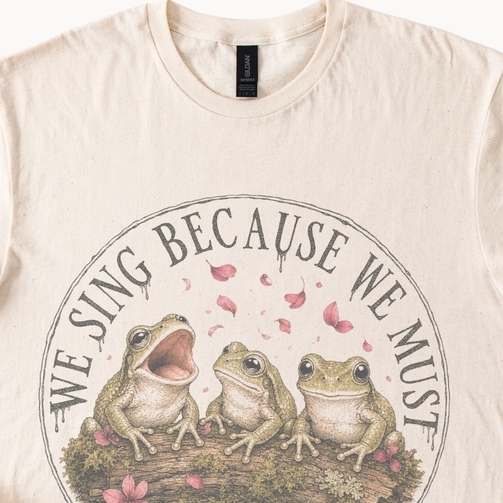 We Sing Because We Must Frog Graphic Tee Natural Cotton